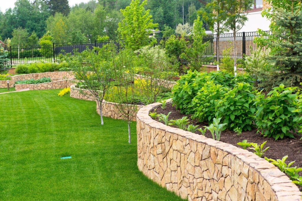 Terraced garden with stone walls and lush green plants